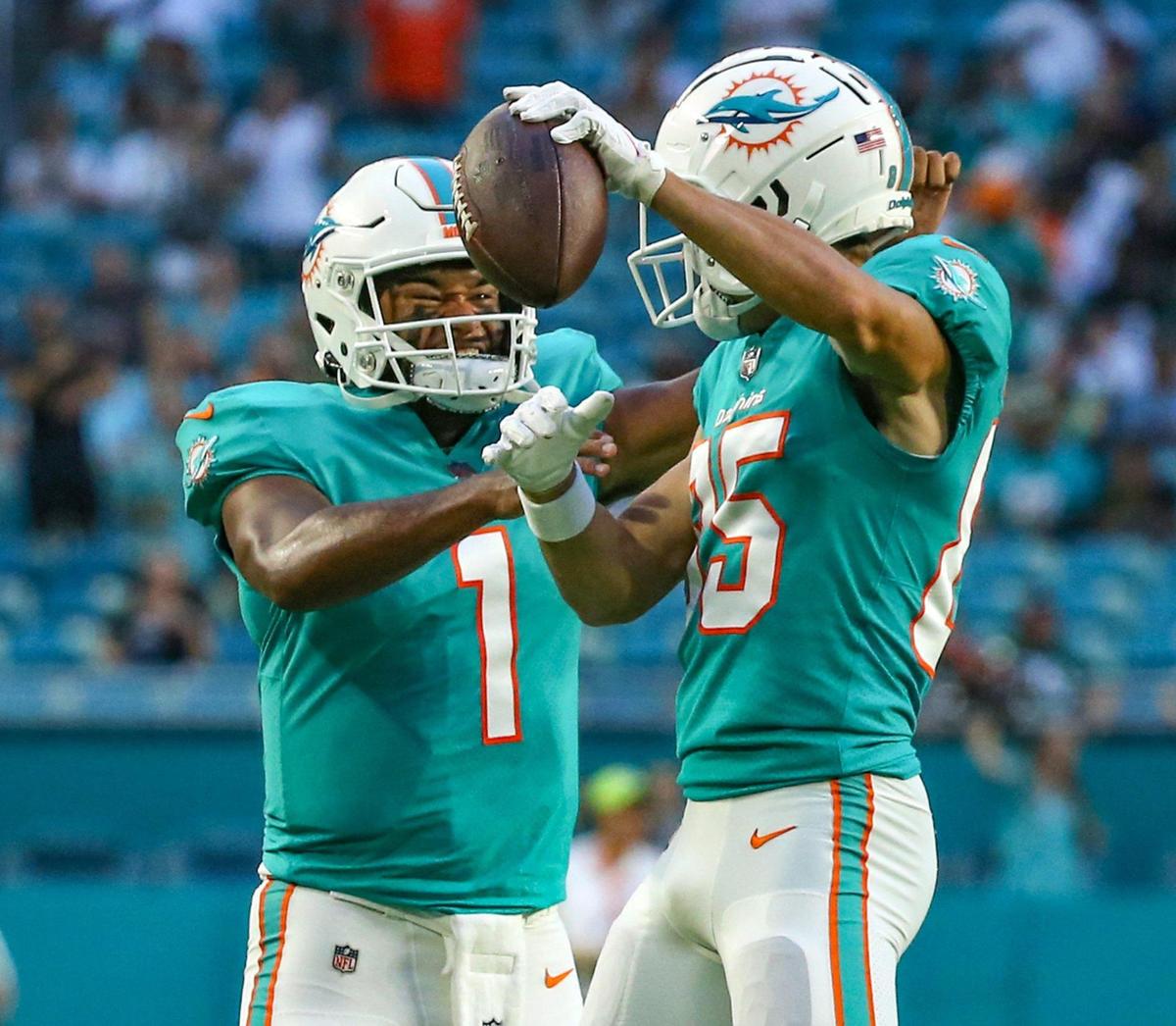 Miami Dolphins quarterback Tua Tagovailoa (1) and Miami Dolphins wide receiver River Cracraft (85) celebrates after scoring in the first quarter against Philadelphia Eagles at Hard Rock Stadium in Miami Gardens on Saturday, August 27, 2022.