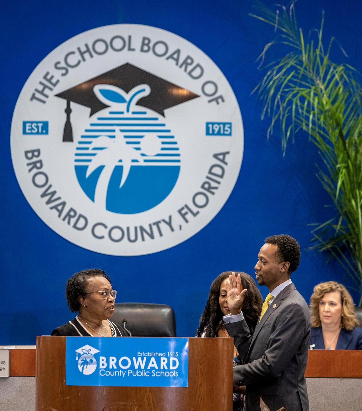 Torey Alston, District 2, raises his right hand as Dr. Earline Smiley swears him in to the Broward School Board in Fort Lauderdale, on August 30, 2022. On Tuesday, Nov. 15, Alston had proposed naming Smiley as interim superintendent to replace Vickie Cartwright, whom the board fired abruptly in a 5-4 vote Monday evening. The board rejected Alston’s motion and instead voted to conduct a national search.
