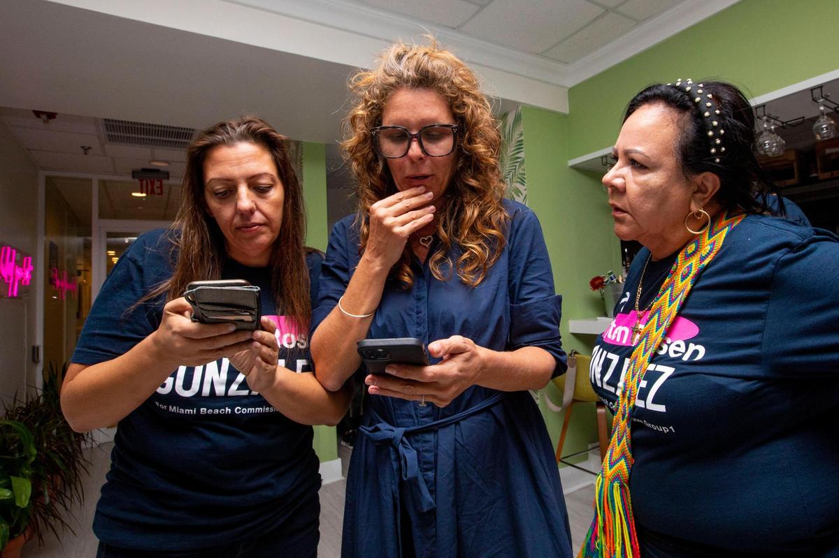 Kristen Rosen Gonzalez, center, campaign manager Monica Matteo-Salinas, left, and campaign worker Liliana Martinez await election results at Cafe Bernie in Miami Beach on Nov. 16, 2021. Matteo-Salinas now works as Rosen Gonzalez’s legislative aide.