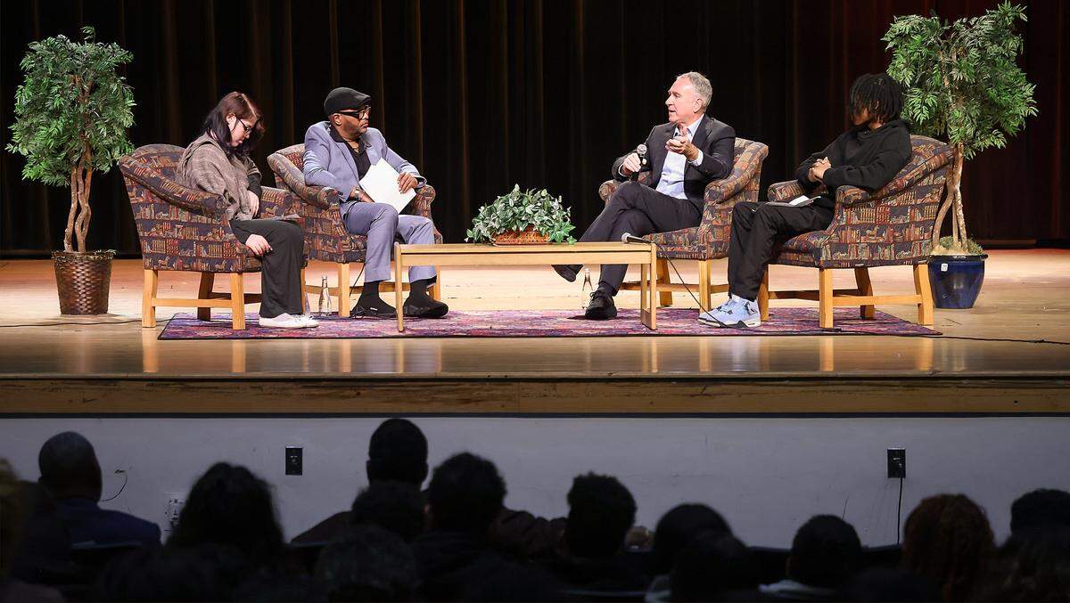 Ken Griffin, third from left, answers questions from student SkyyLynn Windhauser, left, teacher Malik Padgett, and student Sebastian Mejia, right, during his visit to Booker T. Washington Senior High School on Tuesday, Feb. 24, 2026, in Miami, Florida.