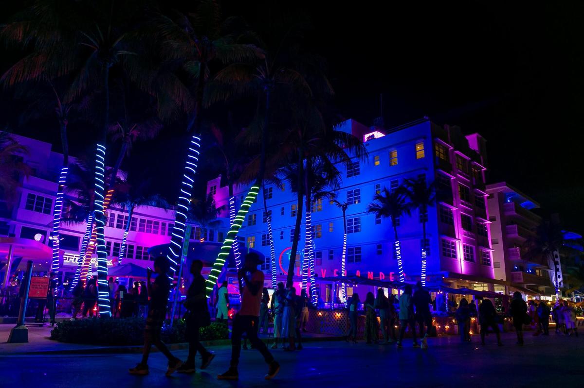South Beach visitors make their way down Ocean Drive near the Clevelander in Miami Beach, Florida during the start of Memorial Day Weekend on Friday, May 28, 2021.