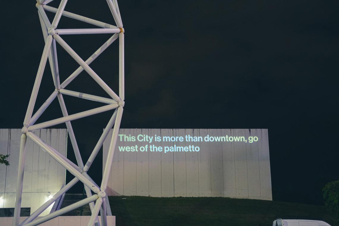 A projection from the series This City is in Bayfront Park during the O, Miami Poetry Festival.