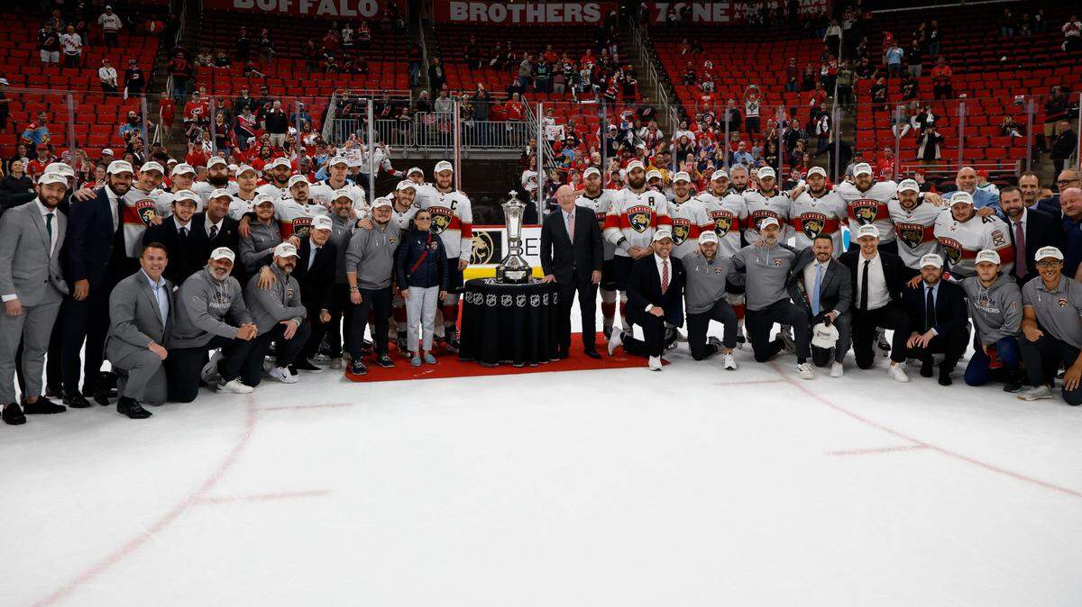 May 28, 2025; Raleigh, North Carolina, USA; Florida Panthers pose with the Prince of Wales Trophy as they advance to the finals after wining against the Carolina Hurricanes in game five of the Eastern Conference Final of the 2025 Stanley Cup Playoffs at Lenovo Center. Mandatory Credit: Geoff Burke-Imagn Images