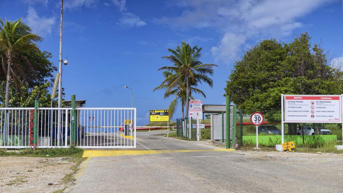 A warning sign stands at the entrance of the PDVSA/BOPEC Brasil Terminal in Rincon Bonaire on the Caribbean Netherlands island of Bonaire, Monday, May 7, 2018, where Venezuela refines and stores its heavy crude. U.S. oil giant ConocoPhillips is pressing for control of Venezuela's key offshore operations in the Caribbean, seeking to recoup $2 billion from a decade-old dispute.