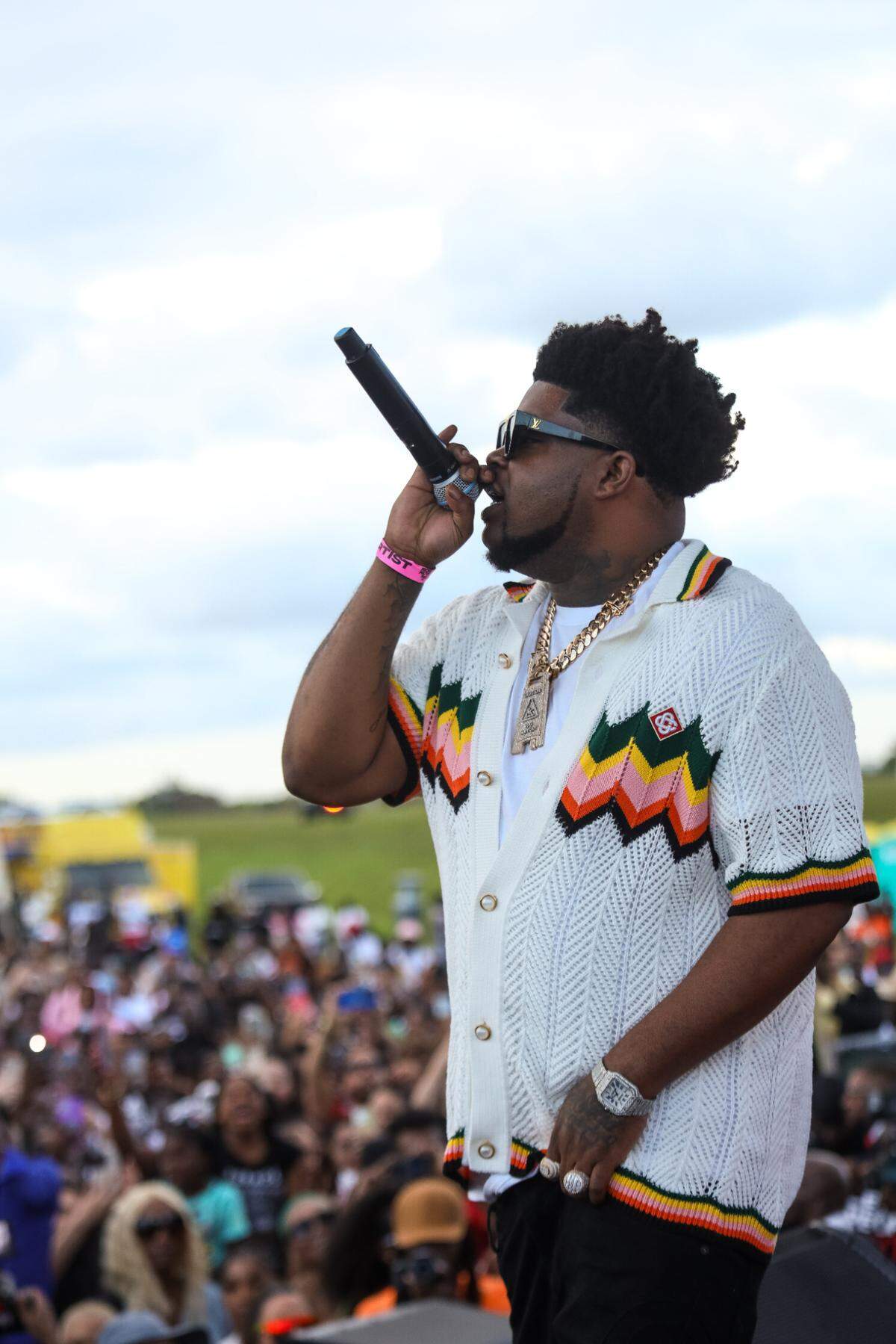 BossMan Dlow raps on stage at the People Matter Fest on Sunday, March 24.
