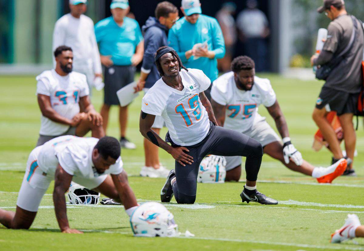 Miami Dolphins wide receiver Preston Williams (18) stretches during the NFL football team’s organized team activities at Baptist Health Training Complex in Hard Rock Stadium on Tuesday, May 24, 2022 in Miami Gardens, Florida, in preparation for their 2022-23 NFL season.
