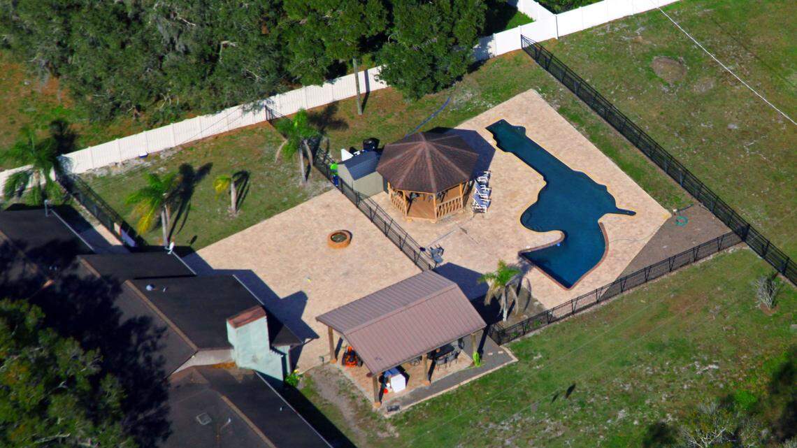 Louis and Raye Ellen Minardi have a gun-shaped pool in the backyard of their Odessa, Florida, home on Gunn Highway as seen in this aerial on Jan. 24, 2023.