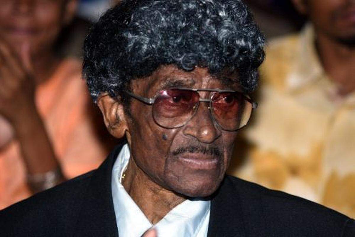 Clyde Killens, best know for bringing famed music to Miami like Dionne Warwick, Count Basie and Aretha Franklin, listens to the Melton Mustafa Orchestra at the Lyric Theater. The Overtown NET hosted the event.