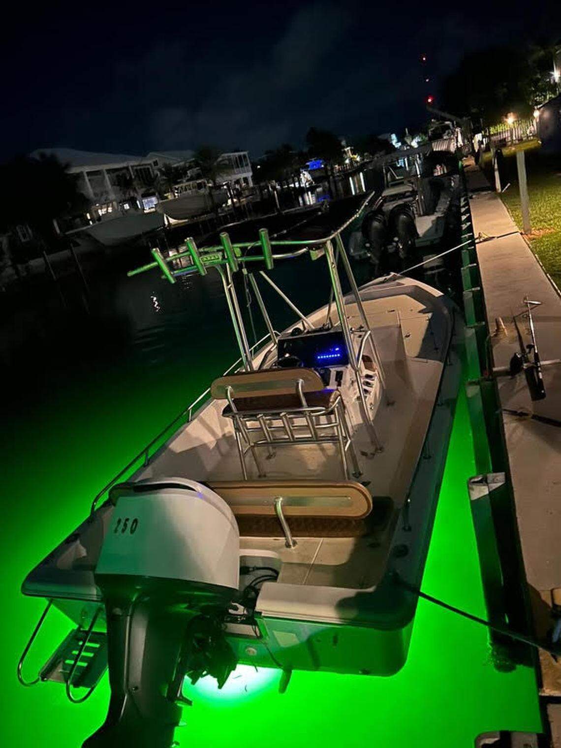 A center console boat is tied to a South Florida dock that the Monroe County Sheriff’s Office says was involved in a human smuggling operation in the Florida Keys Sunday, Aug. 19, 2024.