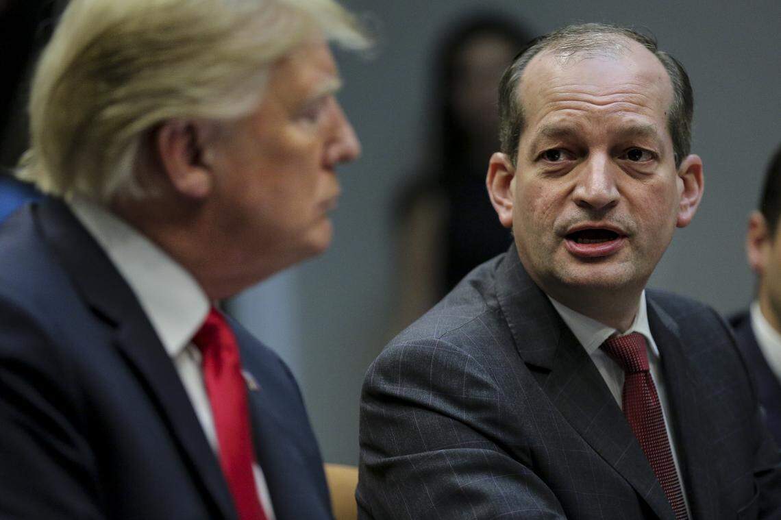Alex Acosta, right, speaks as President Donald Trump listens at the White House on September 17, 2018 in Washington, DC.