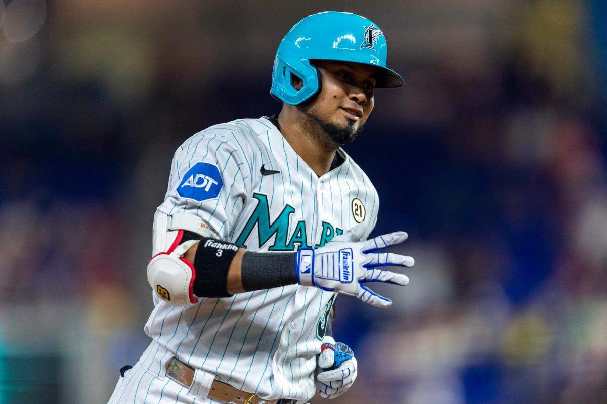 Miami Marlins base runner Luis Arraez (3) reacts to homering as he rounds the bases during the first inning of an MLB game against the Atlanta Braves at loanDepot park in the Little Havana neighborhood of Miami, Florida, on Friday, September 15, 2023