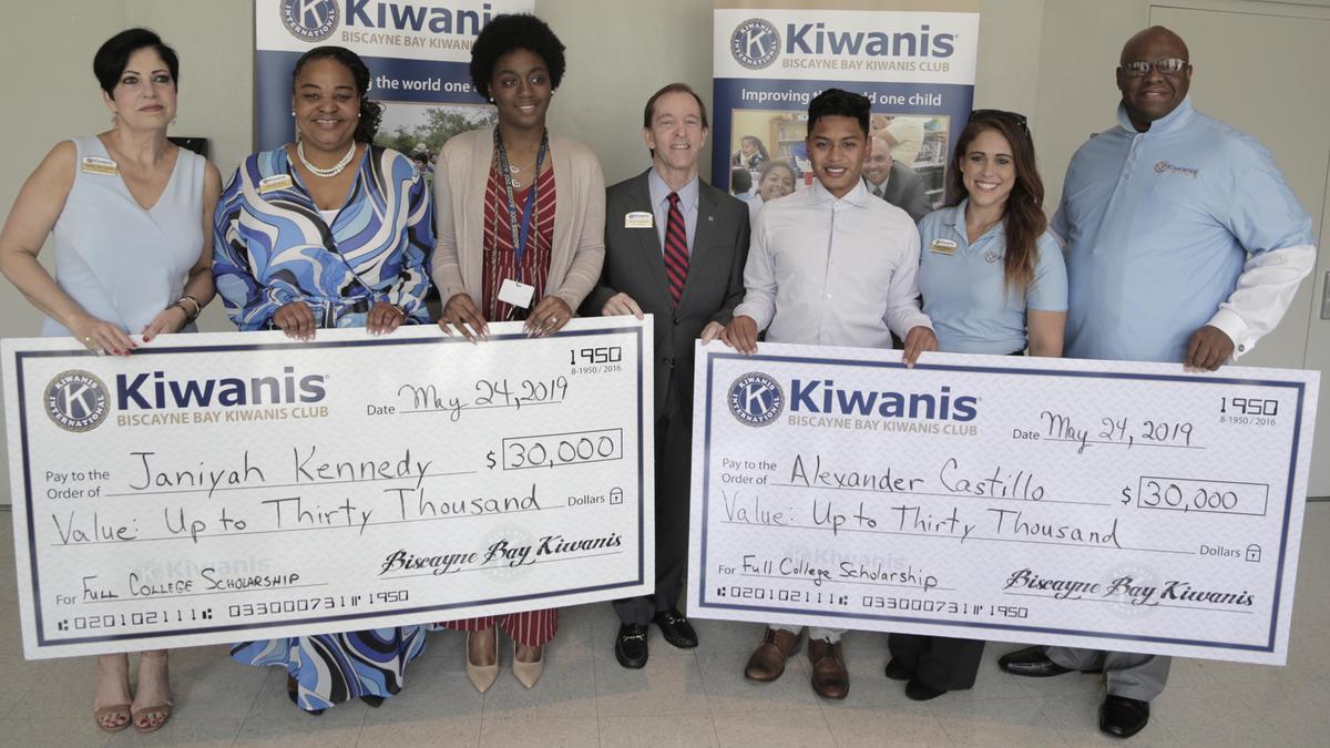 From left: Nellie Hernandez, Past President of the Biscayne Bay Kiwanis Club, Vyonda Moss, Director-Sponsored Youth, Biscayne Bay Kiwanis Club, Janiyah Kennedy, Rick Freeman, Past President of the Biscayne Bay Kiwanis Club, Alexander Castillo, Kellie Gayoso, President, Biscayne Bay Kiwanis Club, and Bob Arnold, Scholarship Committee, Biscayne Bay Kiwanis Club pose for a photo. Kennedy and Castillo received fully paid college scholarships from the Biscayne Bay Kiwanis Club, valued at up to $30,000.