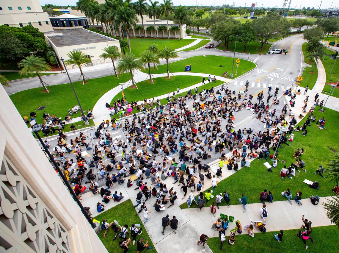 Protesters kneel for eight minutes and 46 seconds in honor of George Floyd during a protest for Black Lives Matter at Florida International University in Miami, Florida on Saturday, June 6, 2020.