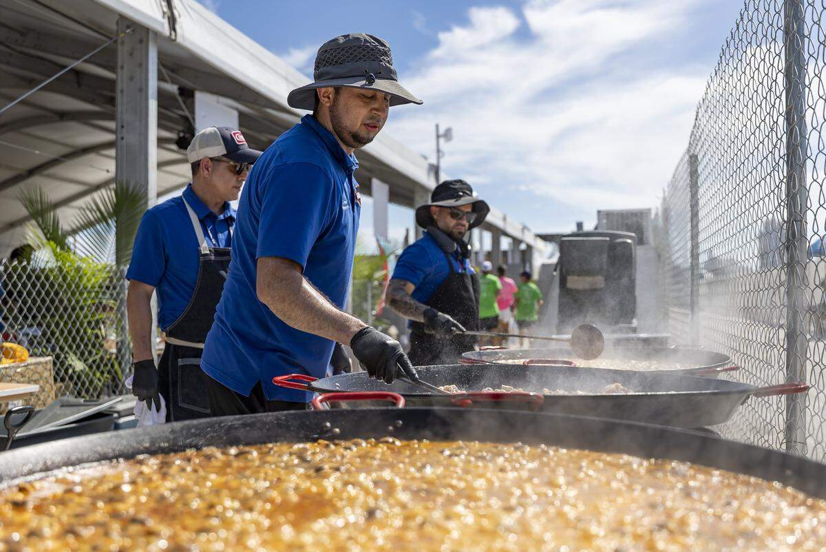 Eldre Siles, a sous chef at Bulla Gastrobar, prepares paella for guests attending the Goya Foods' Grand Tasting Village during the Food Network South Beach Wine & Food Festival on Saturday, Feb. 21, 2026, in Miami Beach, Fla.