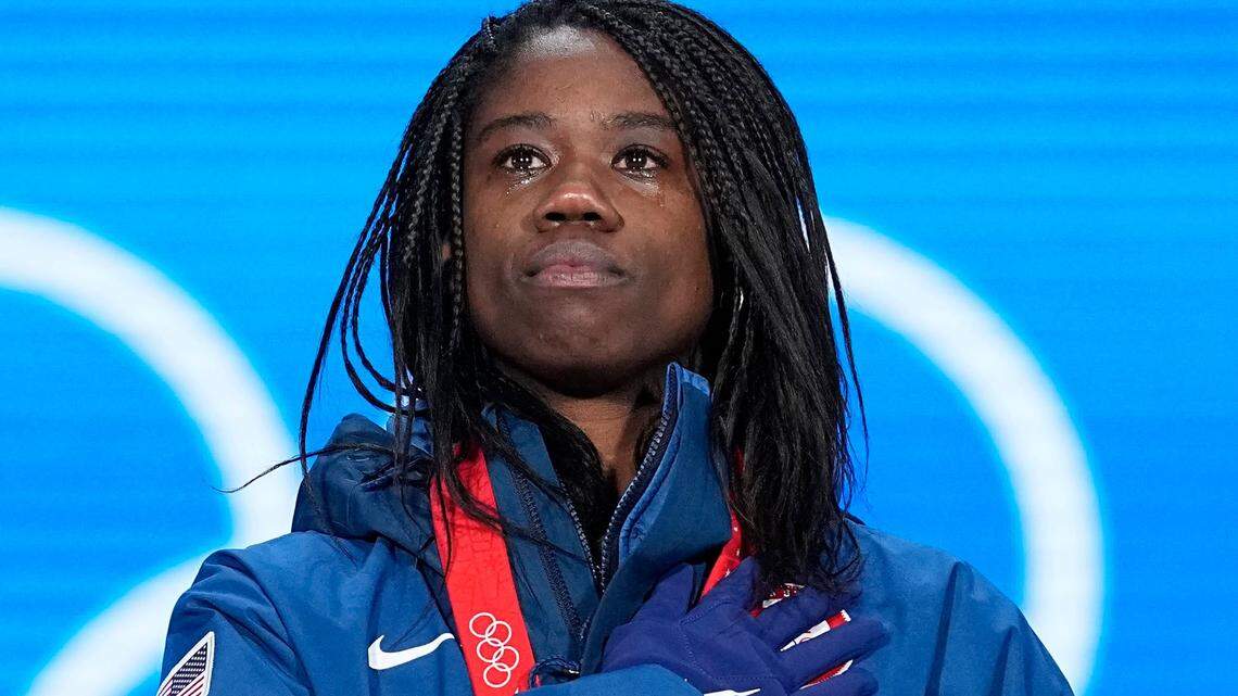Gold Medalist Erin Jackson, who is from Ocala, Florida, stands for the U.S. National Anthem during the medal ceremony for the speed skating women’s 500-meter race at the 2022 Winter Olympics, Monday, Feb. 14, 2022, in Beijing.