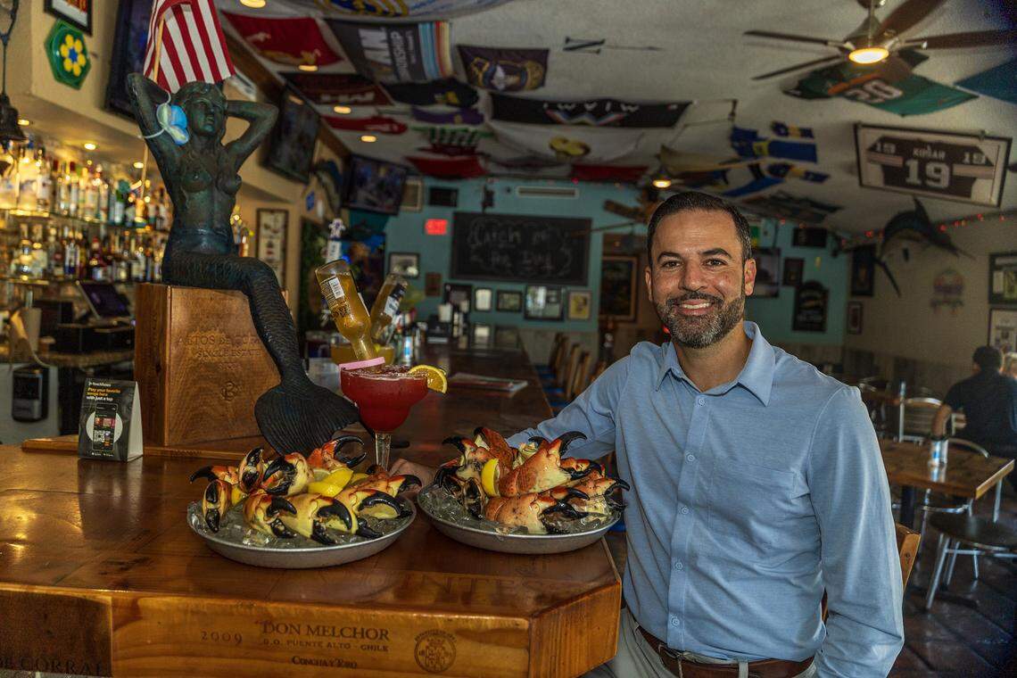 Owner Eric Castellanos displays a couple Stone Crab trays, ahead of the beginning of the Stone Crab season at the iconic Catch of the Day Restaurant on Lejeune Avenue in Miami, on Tuesday October, 14 2025.