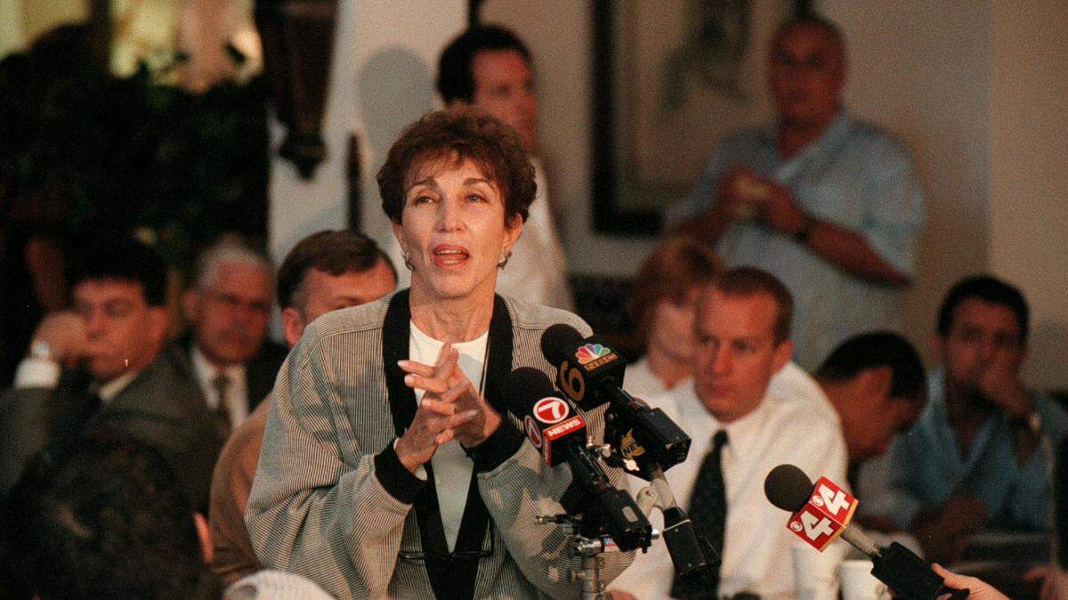In this file photo from Oct. 7, 1997, Jo Ann Weiss Sawitz Bass, owner of Joe's Stone Crab, talks to the crowd that came to the roll call, which is an annual event to hire waiters for the historic restaurant’s seasonal opening.