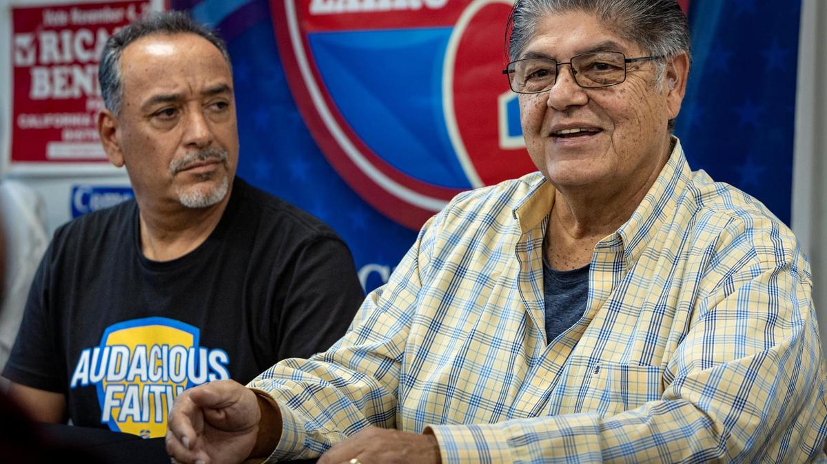 David Hernandez, right, with Benito Bernal, discusses the candidacy of Miami Mayor Francis Suarez at the Los Angeles Hispanic Republican Club. Hernandez is club president.