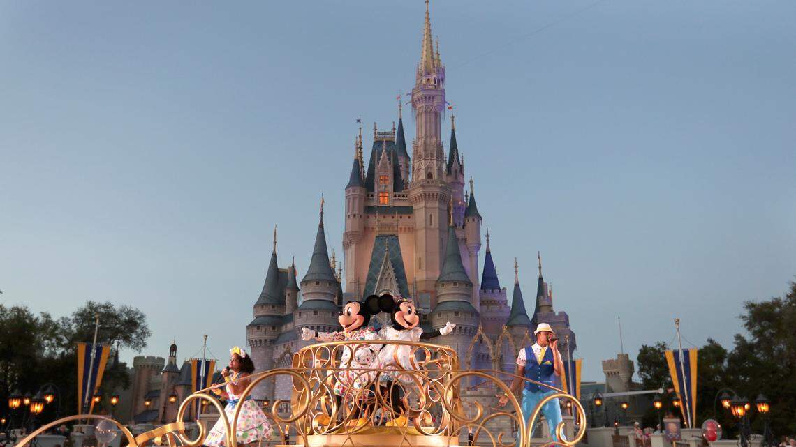 In this stock photo, Mickey and Minnie Mouse perform during a parade as they pass by the Cinderella Castle at the Magic Kingdom theme park at Walt Disney World in Lake Buena Vista, Fla. Wednesday, Jan. 15, 2020.