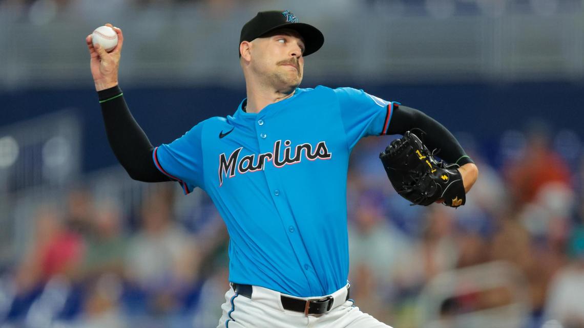 Jul 20, 2025; Miami, Florida, USA; Miami Marlins relief pitcher Janson Junk (26) delivers a pitch against the Kansas City Royals during the first inning at loanDepot Park. Mandatory Credit: Sam Navarro-Imagn Images