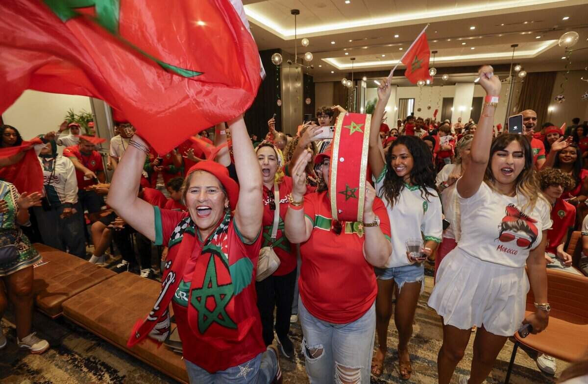 Morocco fan, Lamia Zahloul, at left, reacts as she joins supporters at the Morocco World Cup Watch Party at the Thesis Hotel in Coral Gables, Florida, during the soccer match between Morocco and Brazil on Saturday, June 13, 2026.