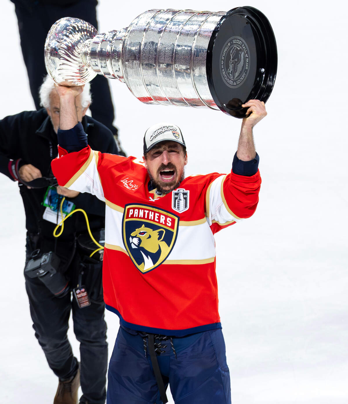 Florida Panthers center Brad Marchand (63) lifts the Stanley Cup after defeating the Edmonton Oilers 5-1 in Game 6 of the Final at Amerant Bank Arena in Sunrise, Fla., on Tuesday, June 17, 2025, clinching the NHL championship.
