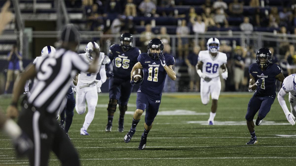 FIU receiver CJ Worton (11) outruns Middle Tennesse defensive backs for a first down during the second quarter of a football game at Riccardo Silva Stadium in Miami, FL, on Saturday, October 13, 2018.