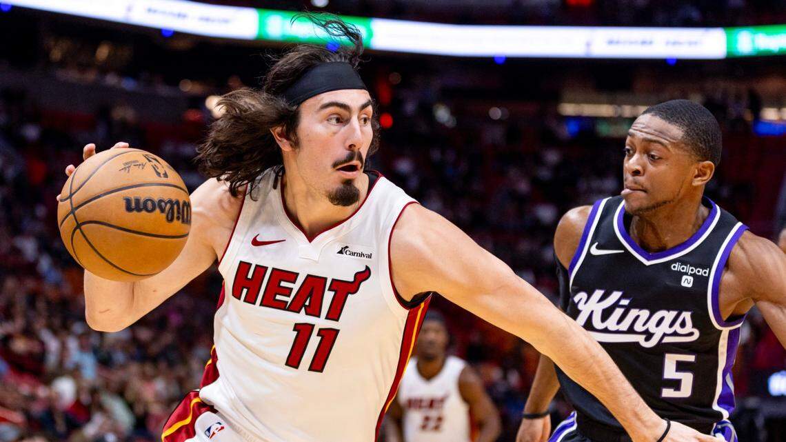 Miami Heat guard Jaime Jaquez Jr. (11) drives on Sacramento Kings guard De’Aaron Fox (5) during the first half of an NBA game at Kaseya Center in Miami on January 31, 2024.