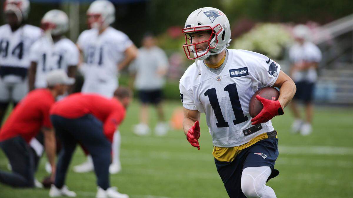 New England Patriots wide receiver Julian Edelman (11) runs with the ball during an NFL football minicamp practice, Wednesday, June 6, 2018, in Foxborough, Mass.