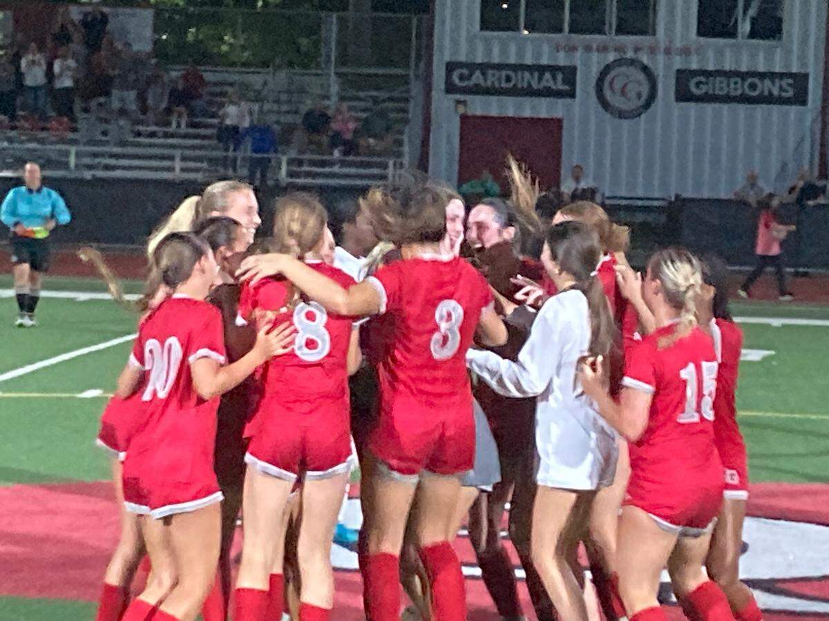 Cardinal Gibbons’ girls’ soccer players celebrate at midfield following their 1-0 victory over NSU University School on Wednesday in the Region 4-3A final.