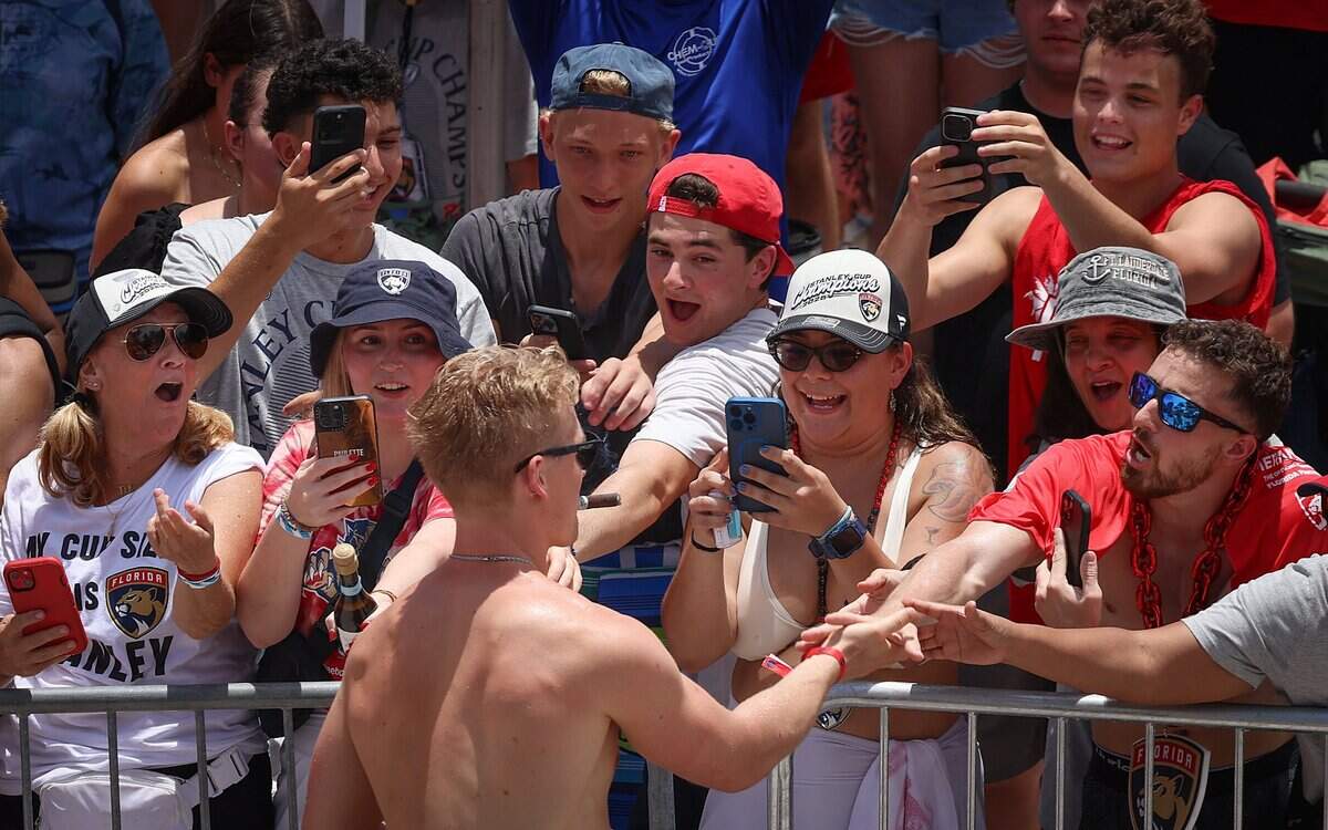 Florida Panthers defenseman Gustav Forsling greets fans on A1A just north of the staging area for the Florida Panthers Stanley Cup championship celebration parade on Sunday, June 22, 2025 in Fort Lauderdale, Florida.