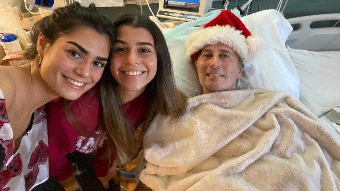 Nino Pernetti, owner of Caffe Abbracci, with daughters Tatiana, left, and Katerina, has been hospitalized for more than a year, recovering from the ravages of COVID-19.
