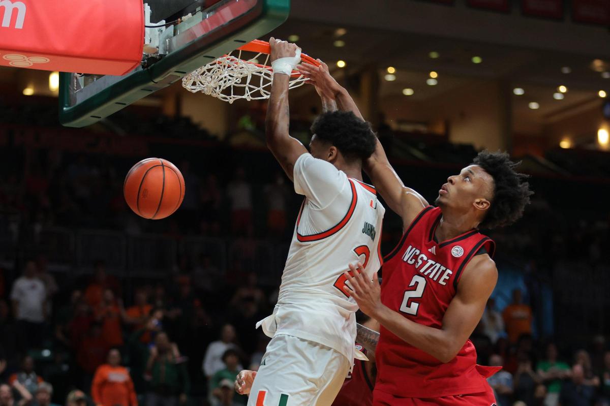 Miami Hurricanes forward Brandon Johnson (2) scores the game-winning basket past North Carolina State Wolfpack guard Paul McNeil (2) during the second half of their ACC basketball game at the Watsco Center in Coral Gables, Florida on Saturday, March 8, 2025.