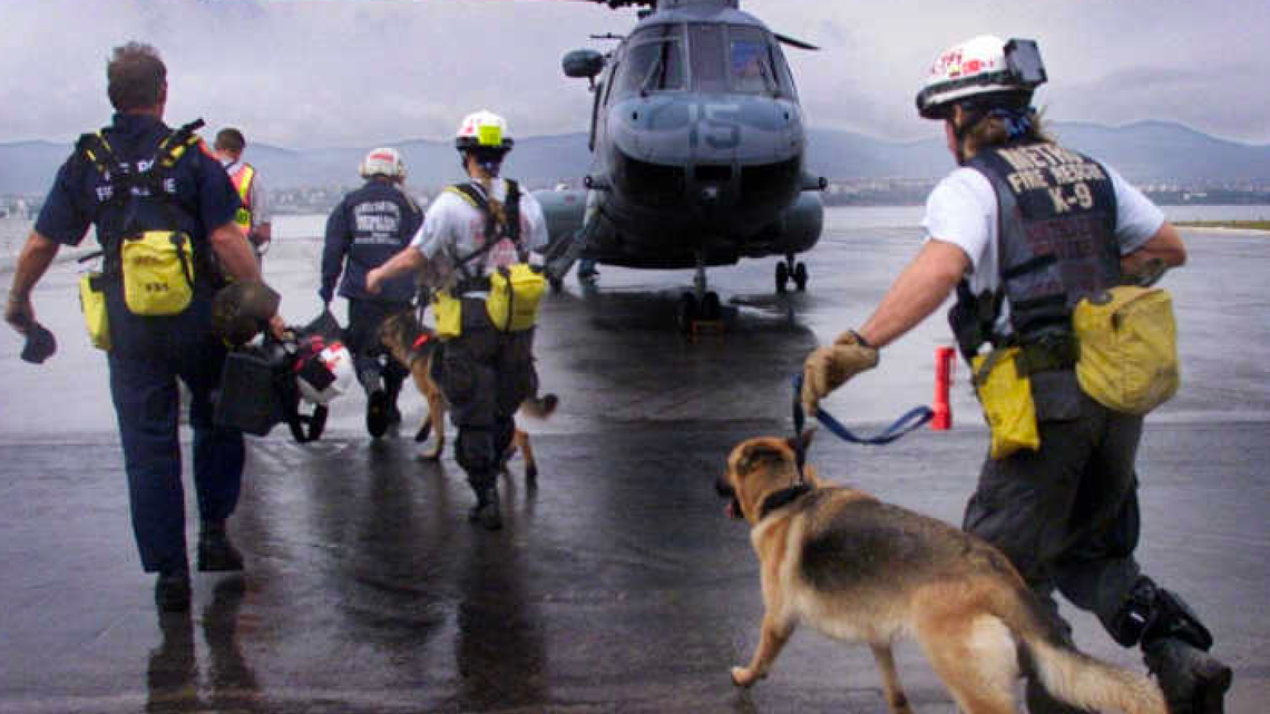 A team from Miami-Dade’s Urban Search and Rescue Task Force runs to board a U.S. Marine helicopter in response to a devastating earthquake in Turkey in 1999.