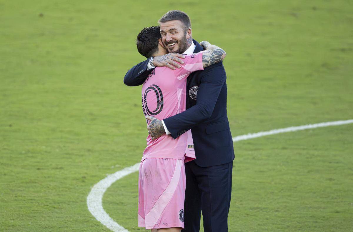 Inter Miami co-owner David Beckham hugs forward Lionel Messi (10) after winning their MLS Cup final match against Vancouver Whitecaps at Chase Stadium on Saturday, Dec. 6, 2025, in Fort Lauderdale, Fla.
