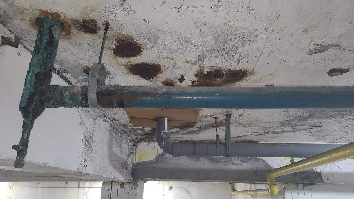 Photos captured by a resident of the Maison Grande Condominium at the building’s parking garage show concrete damage, rusty rebar.