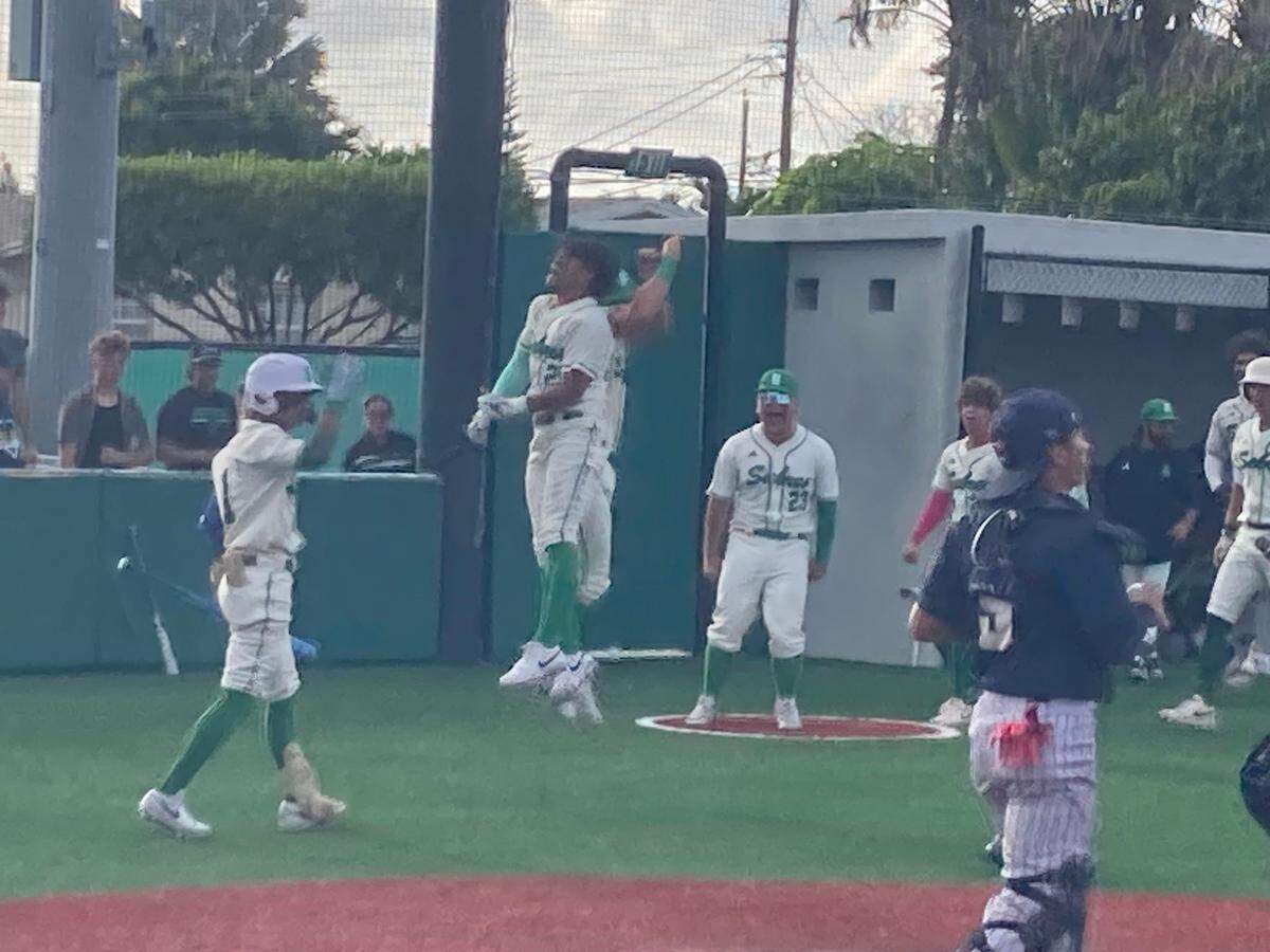 Jan Perez Fernandez celebrates with his St. Brendan baseball teammates after scoring the game-tying run in the bottom of the sixth inning on Thursday during a 2-1 win over Calvary Christian in Game 3 of a Region 4-3A quarterfinal series at St. Brendan.