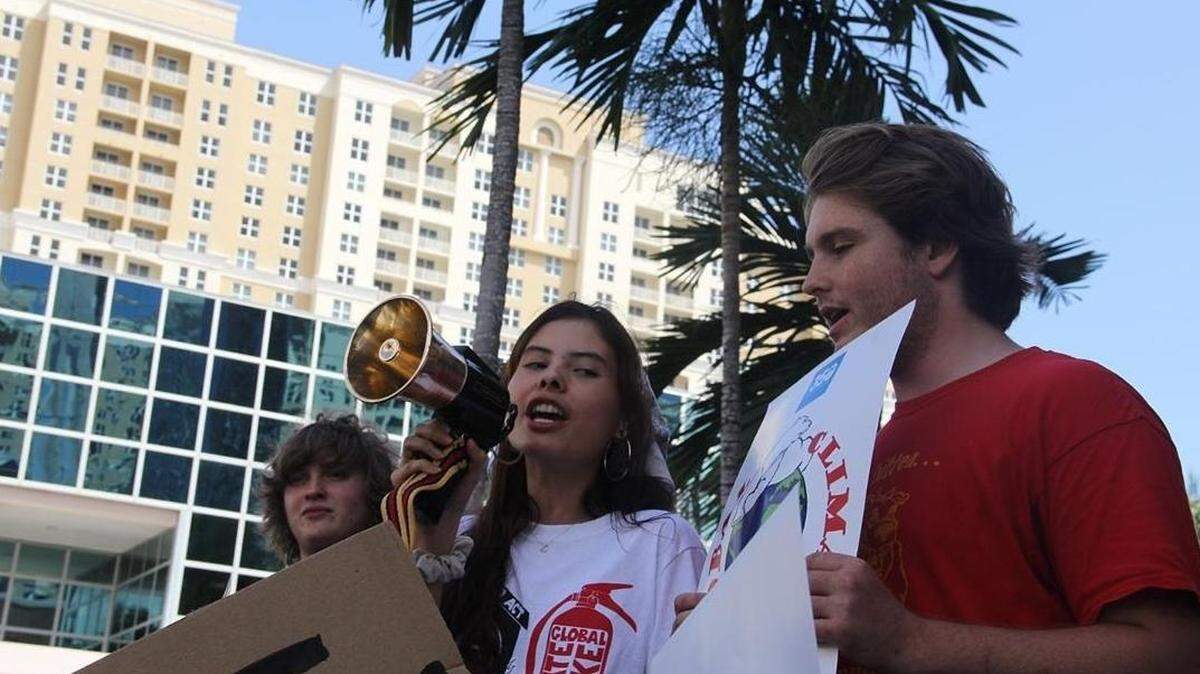 South Broward High senior Elijah Ruby, right, received a suspension and was barred from prom for passing out flyers advertising for the Global Youth Climate Strike. Administrators had told him not to distribute the ads. Ruby attended the local Broward County strike on Friday and was told by the administration that he could attend prom.