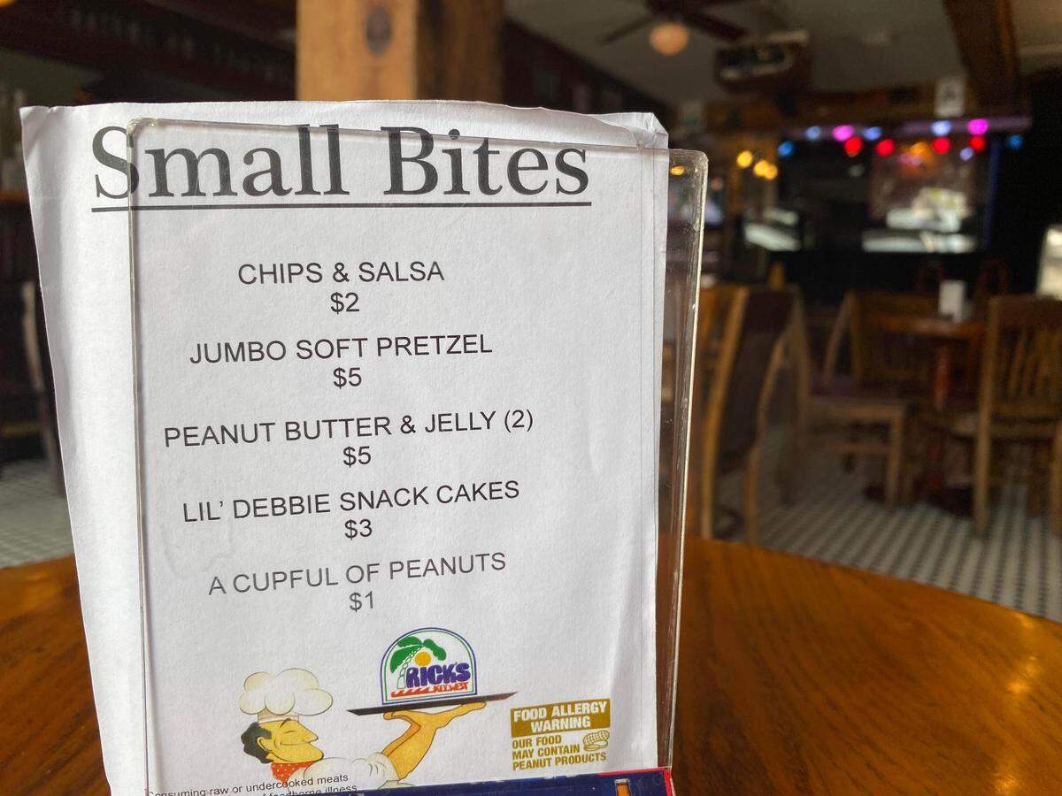 Rick’s Bar in Key West was able to work around the state’s June 26, 2020, bar closure order by obtaining a restaurant license. The “small bites” menu includes a “cupful” of peanuts and Little Debbie snack cakes.
