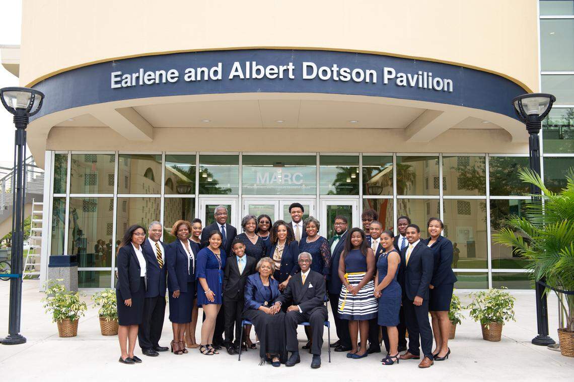 Earlene and Albert Dotson Sr., center, are surrounded by their children and grandchildren during the opening ceremony of a new FIU pavilion bearing their name in 2019.