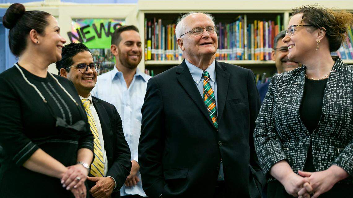 David Lawrence, Jr., center, during a press conference on Florida literacy and early childhood learning at West Miami Middle School in Miami on May 4, 2021.