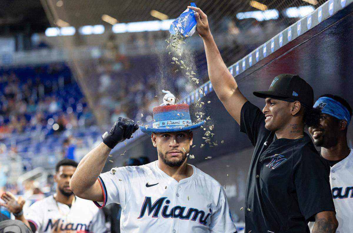 Miami Marlins designated hitter Agustin Ramirez (50) celebrates in the duggout after hitting a home run against the Minnesota Twins in the first inning of their MLB game at loanDepot park on Thursday, July 3, 2025, in Miami, Fla.