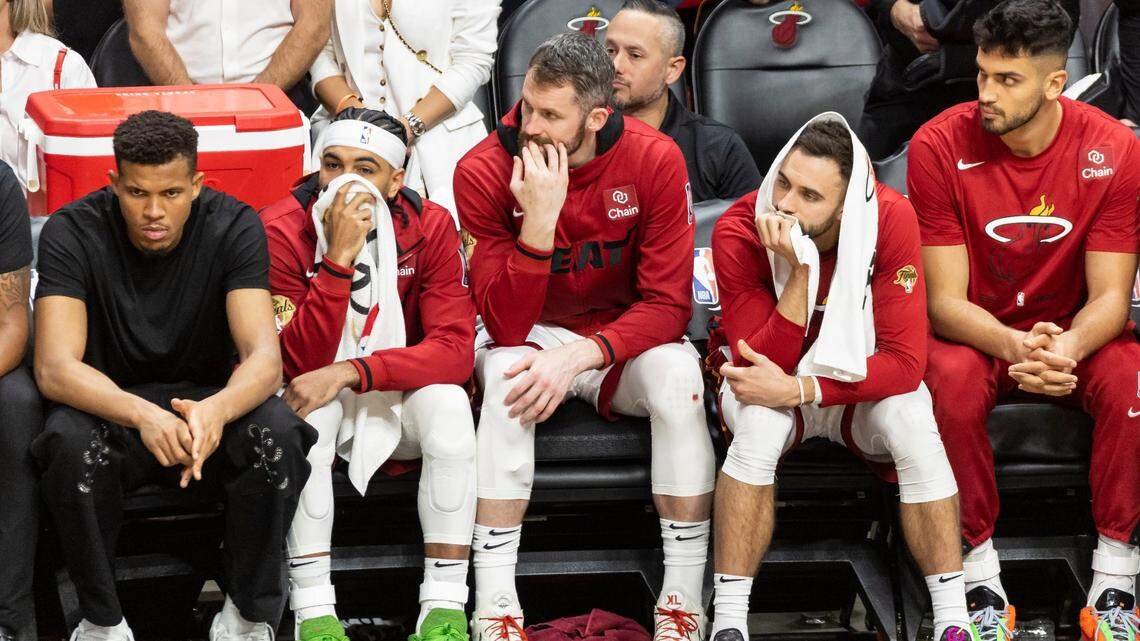 Miami Heat guards Gabe Vincent (2), Max Strus (31) and Kevin Love (42) react on the bench as their team lose against the Denver Nuggets in the second half of Game 4 of the NBA Finals at the Kaseya Center on Friday, June 9, 2023, in downtown Miami, Fla.