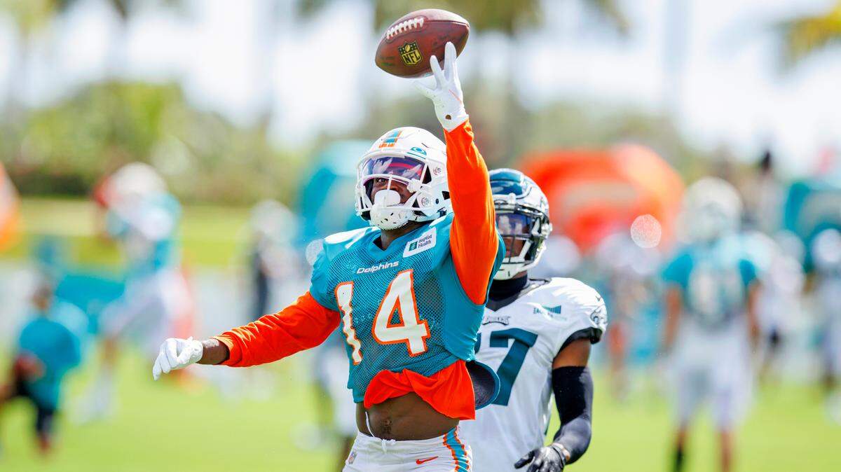 Miami Dolphins wide receiver Trent Sherfield (14) unable to catch a pass against Philadelphia Eagles cornerback Zech McPhearson (27) during an NFL football training camp at Baptist Health Training Complex in Hard Rock Stadium on Wednesday, August 24, 2022 in Miami Gardens, Florida.