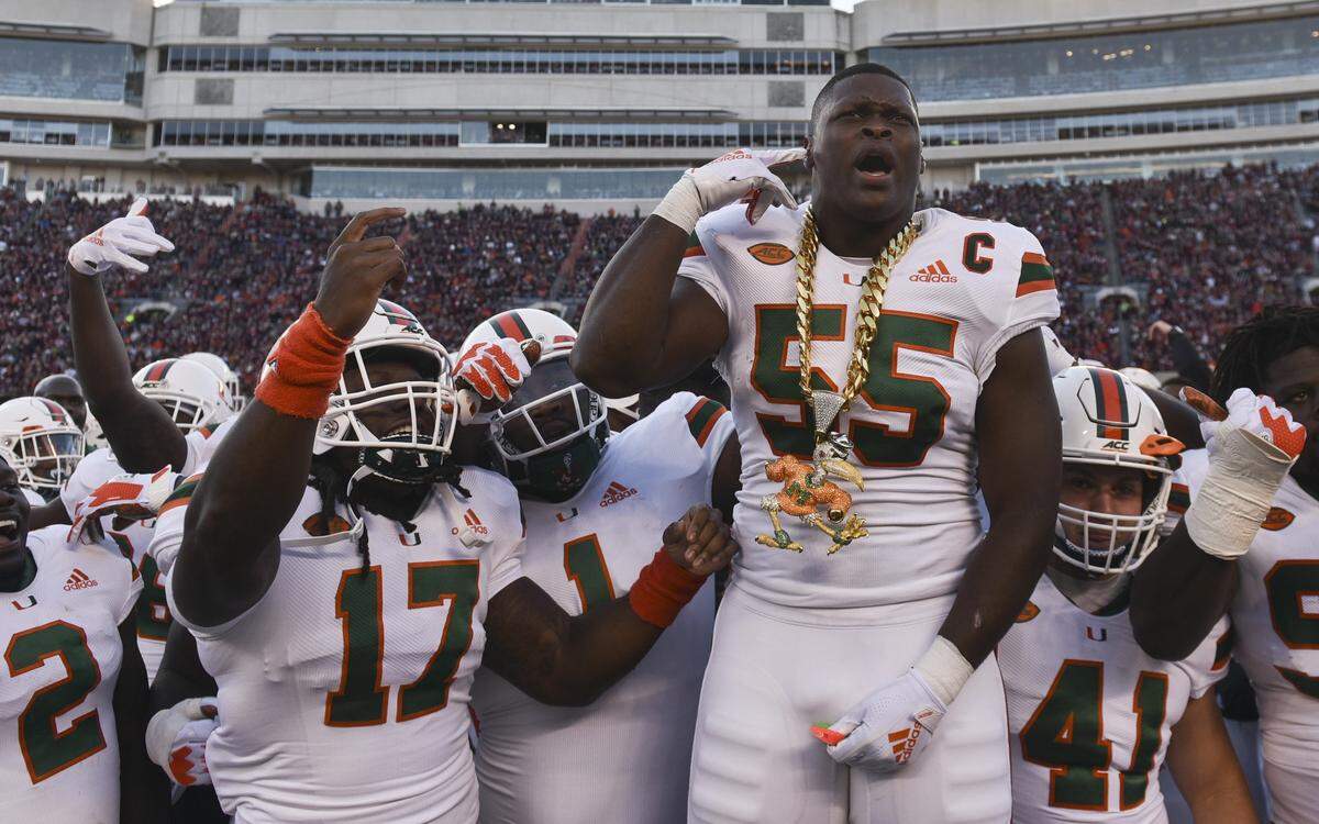 Miami Hurricanes linebacker Shaquille Quarterman (55) celebrates his interception against the Virginia Tech Hokies in the first half at Lane Stadium on Nov. 17, 2018 in Blacksburg, Va.