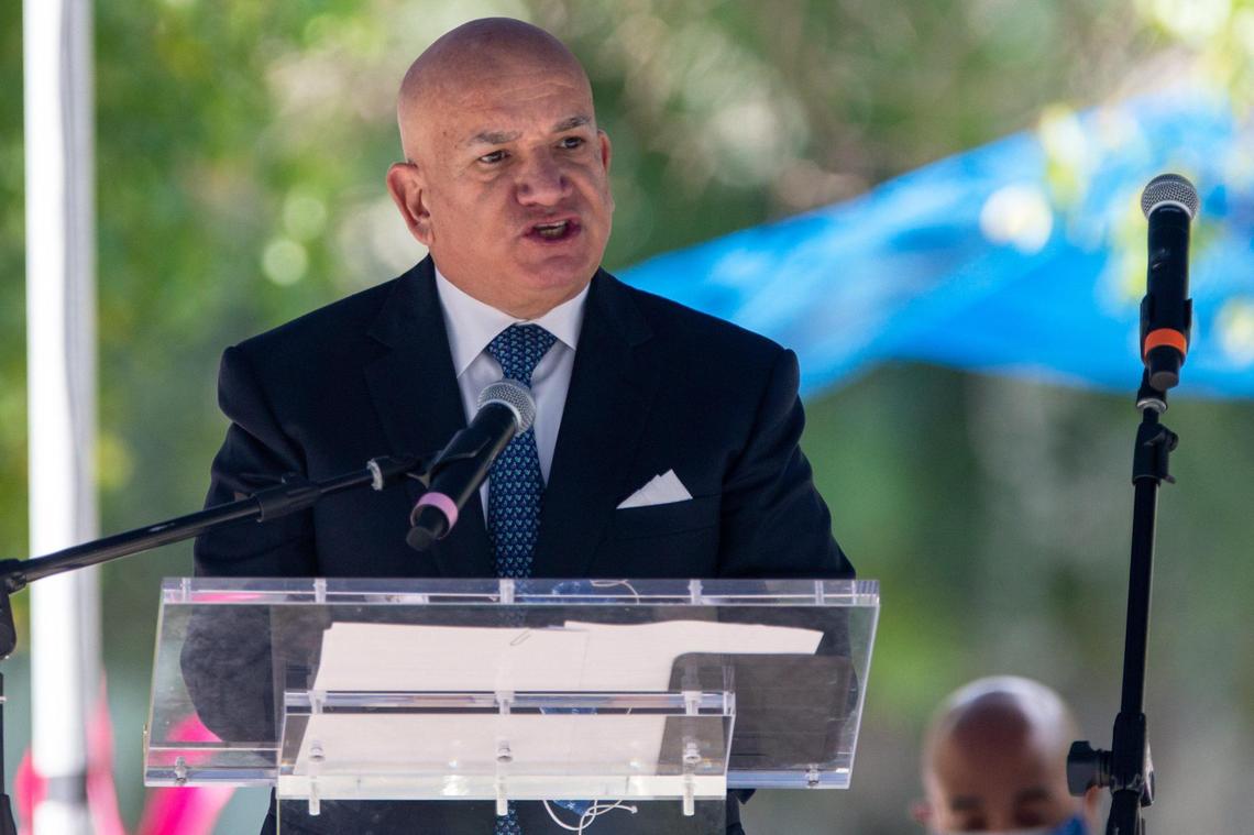 In this March 19, 2021 photo, Carlos Migoya, president and CEO of Jackson Health System, speaks at a ceremony to honor its staff and remember the lives lost in the year since its first COVID-19 patient.