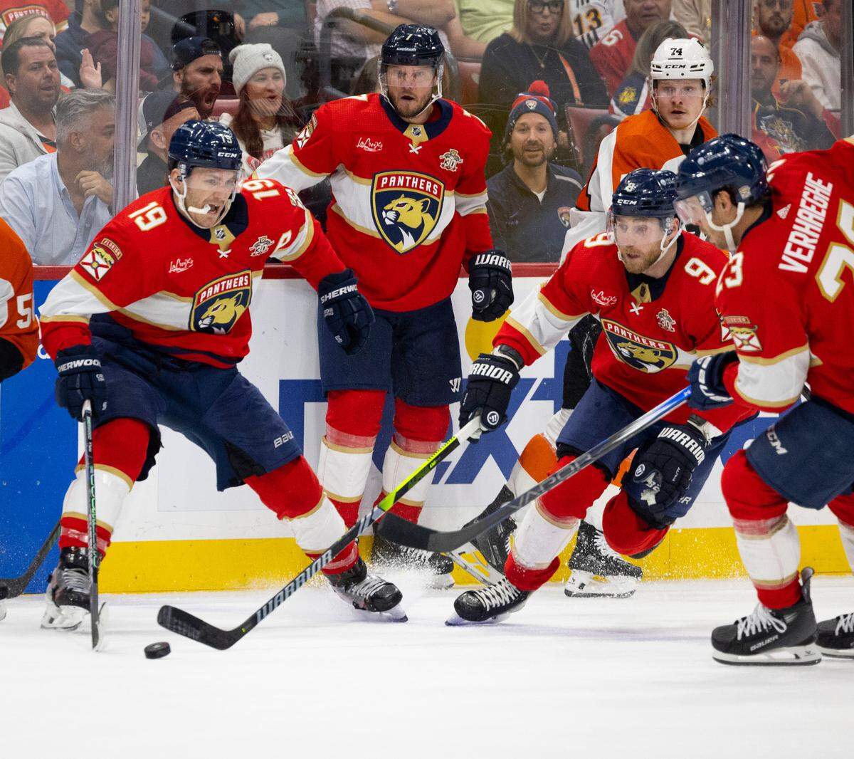 Florida Panthers left wing Matthew Tkachuk (19), center Sam Bennett (9) and center Carter Verhaeghe (23) try to get the puck into their territory during the second period of a NHL game on Thursday, March 7, 2024 at Amerant Bank Arena in Sunrise, Fla.