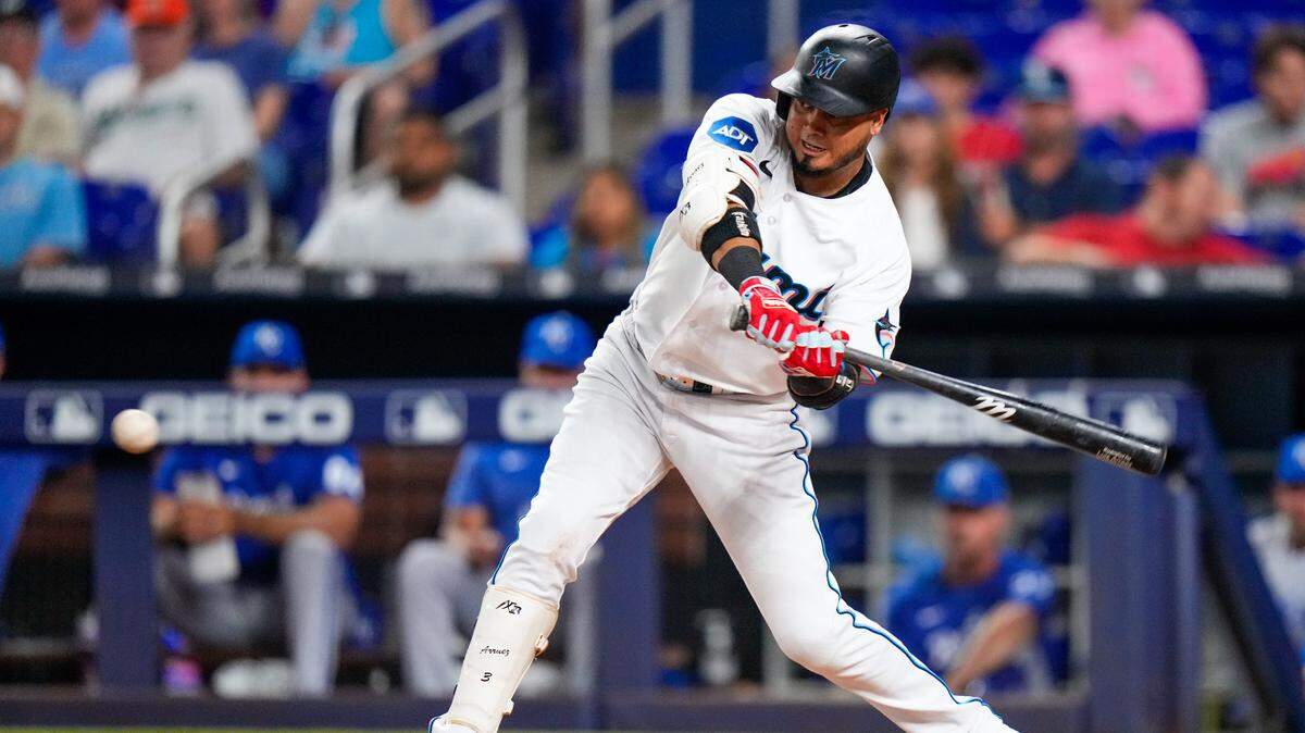 Jun 5, 2023; Miami, Florida, USA; Miami Marlins second baseman Luis Arraez (3) hits a single against the Kansas City Royals during the fourth inning at loanDepot Park. Mandatory Credit: Rich Storry-USA TODAY Sports