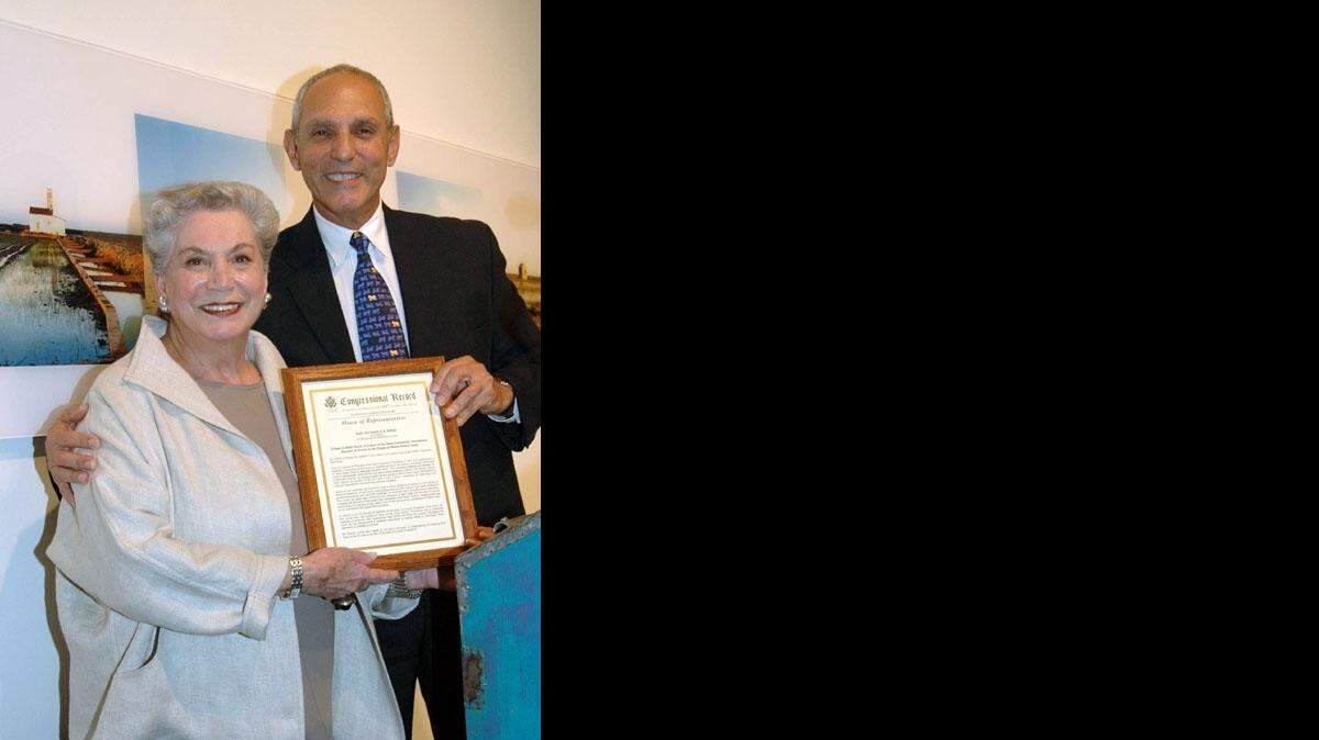 Dade Community Foundation President Ruth Shack and Richard Milstein, then the foundation board chairman, in 2005.