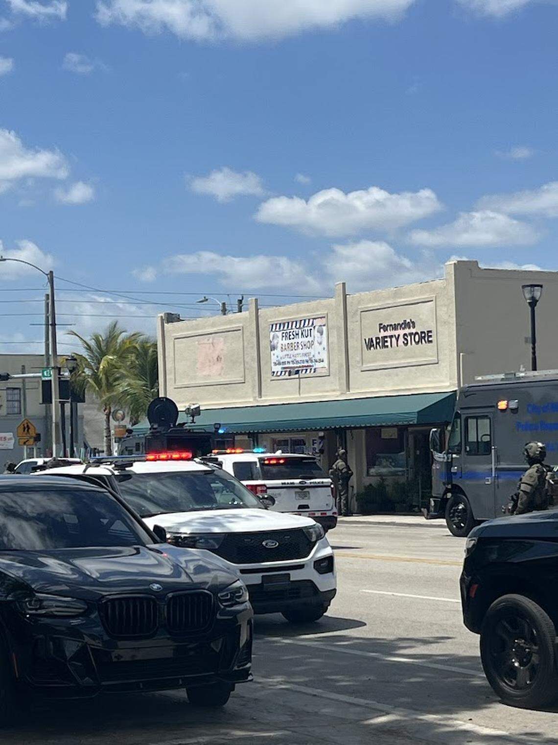 Miami police detain several people outside a Little Haiti barber shop Wednesday, April 30, 2025.